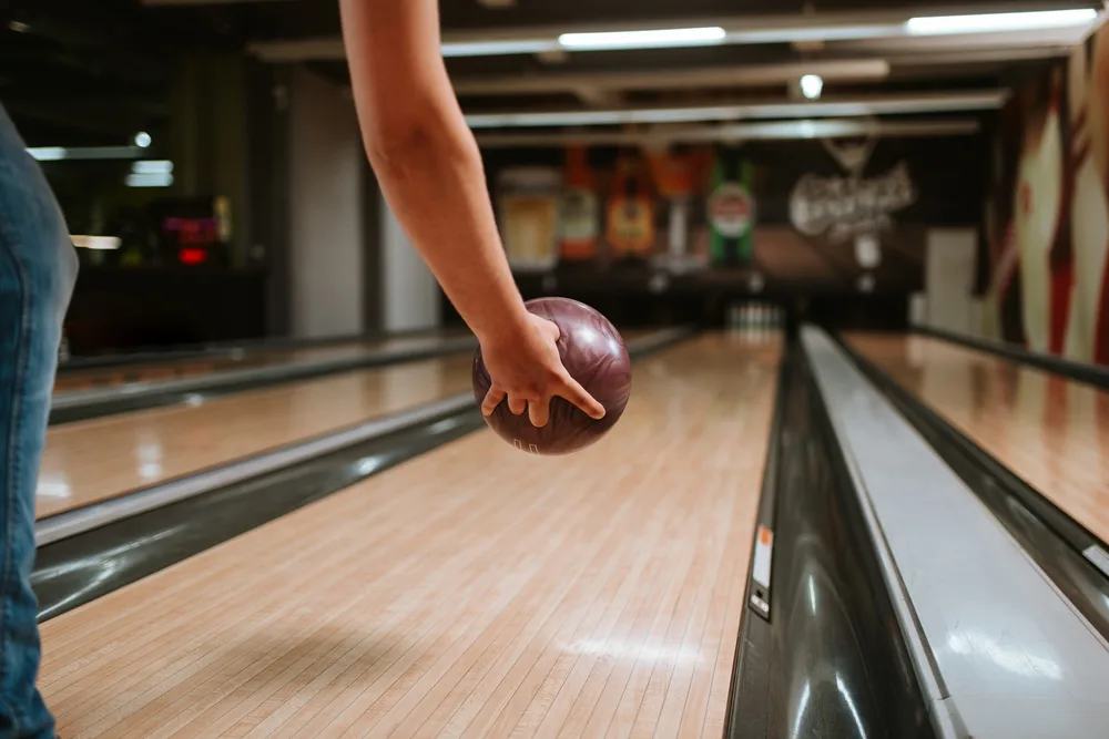 The bowler is rolling on a sports pattern and deciee to roll in the middle