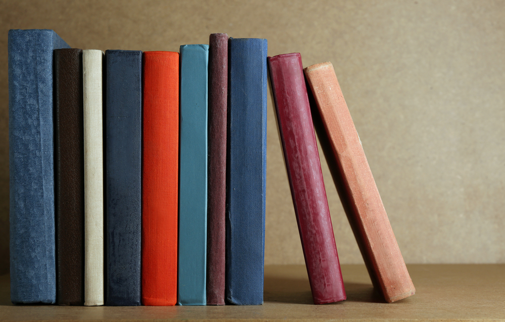 The multi-colored books on the shelf is how to gain success bowling