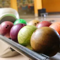 8 bowling balls sitting on ball returned made the bowler wonder what are bowling balls made of