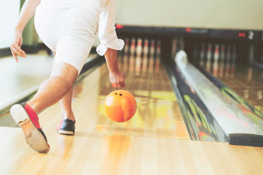 Young man playing bowling decoded to give the sport a try