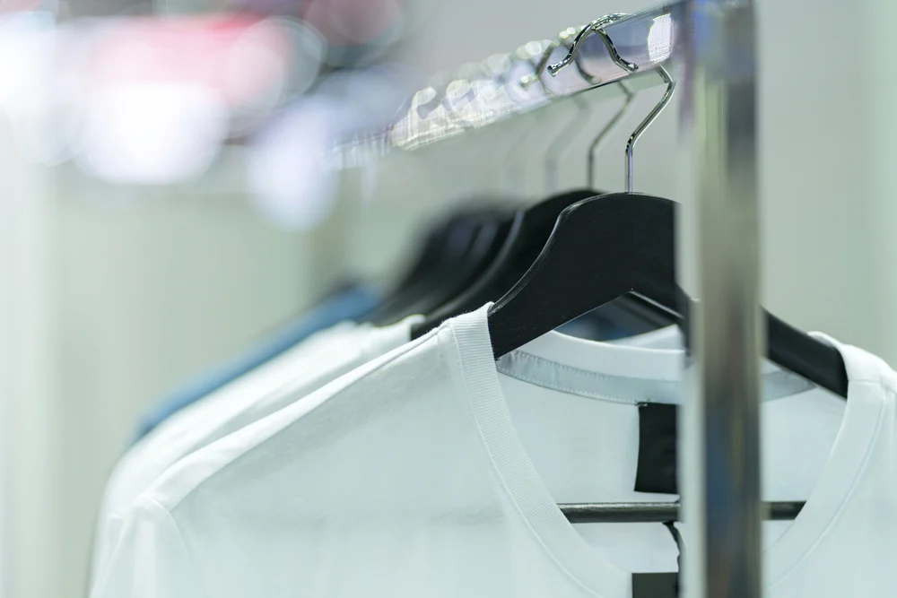 White t shirts hanging on hanger, paired with blue jeans is a super cool look for casual bowlers