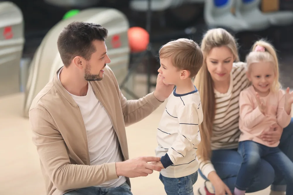 The child in the picture asked his dad about free games and birthday parties