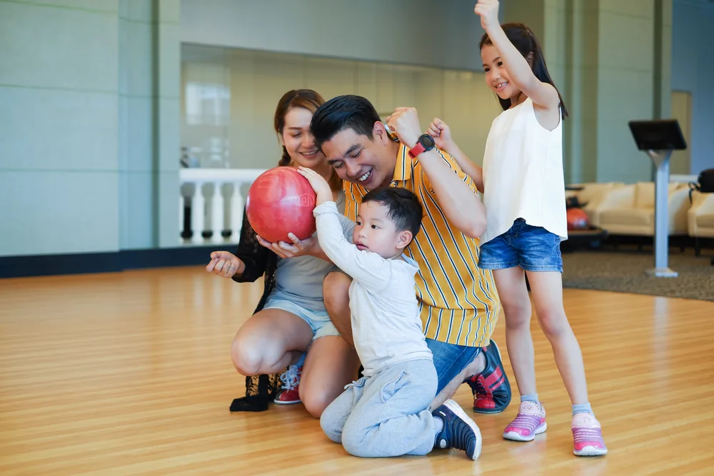 Family of bowlers spend a lot of their rainy days at bowling alleys