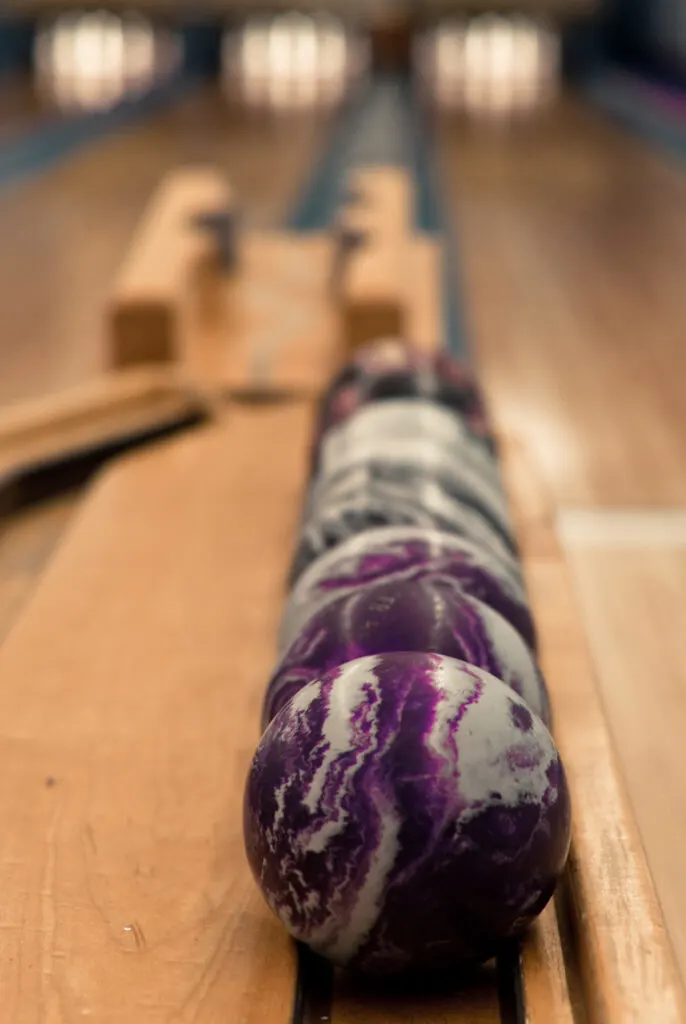 Purple and white swirled rollerball on ball return