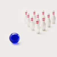 mini bowling game with white pins and blue ball