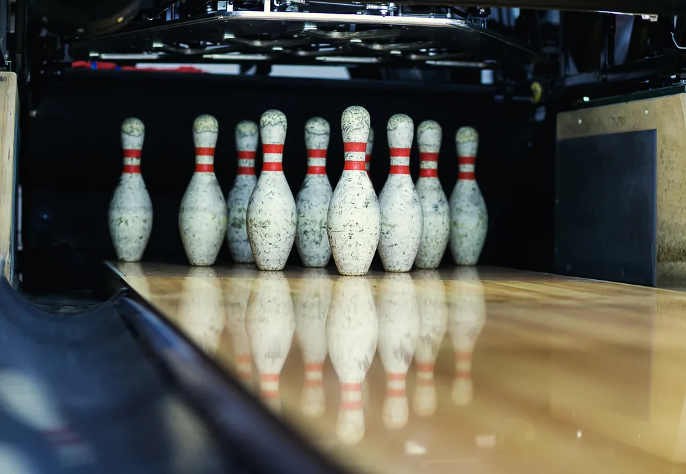 Pins at the end of a bowling alley, no longer use pin boys but automatic pin setters