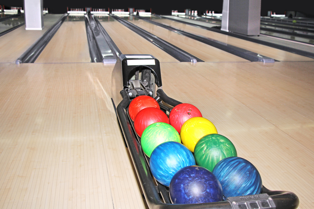 Wide view of the lane surface, showing bowling lanes are slippery