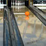 Orange bowling ball on lane