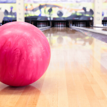 Pink bowling ball on lane butcher alley wax