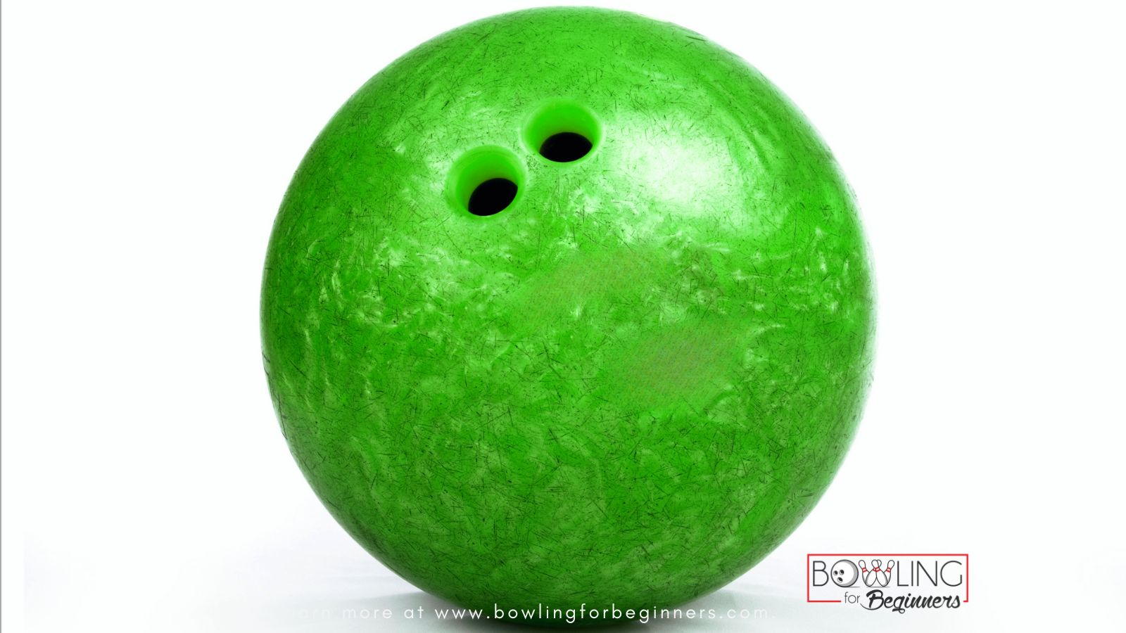 The size holes varies in the green bowling ball.