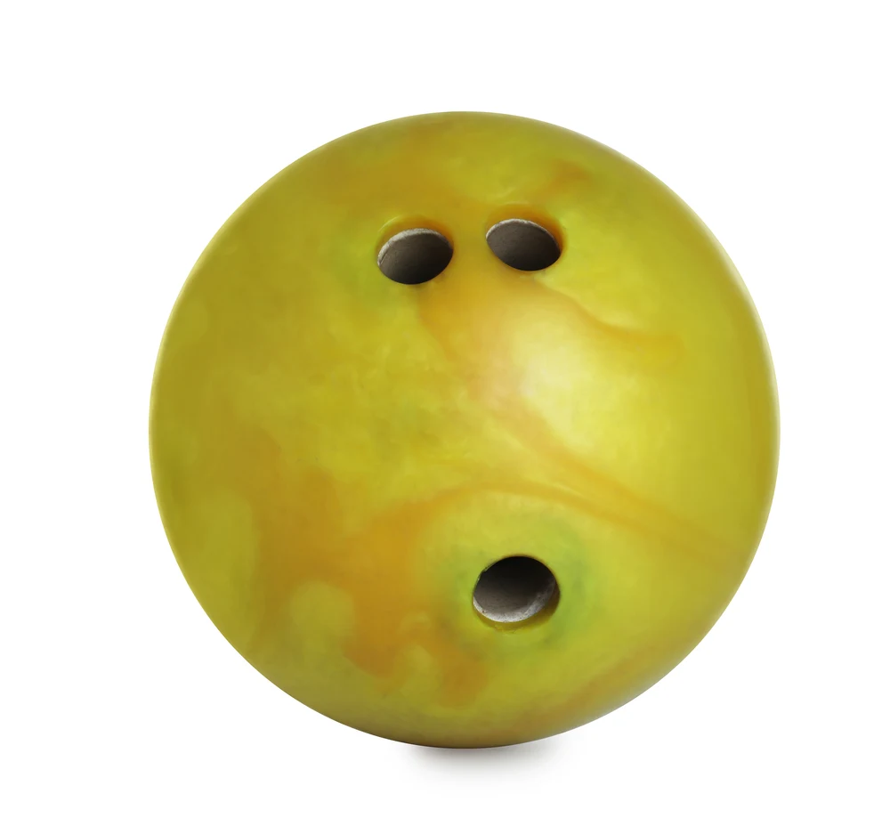 Yellow bowling ball 3 holes