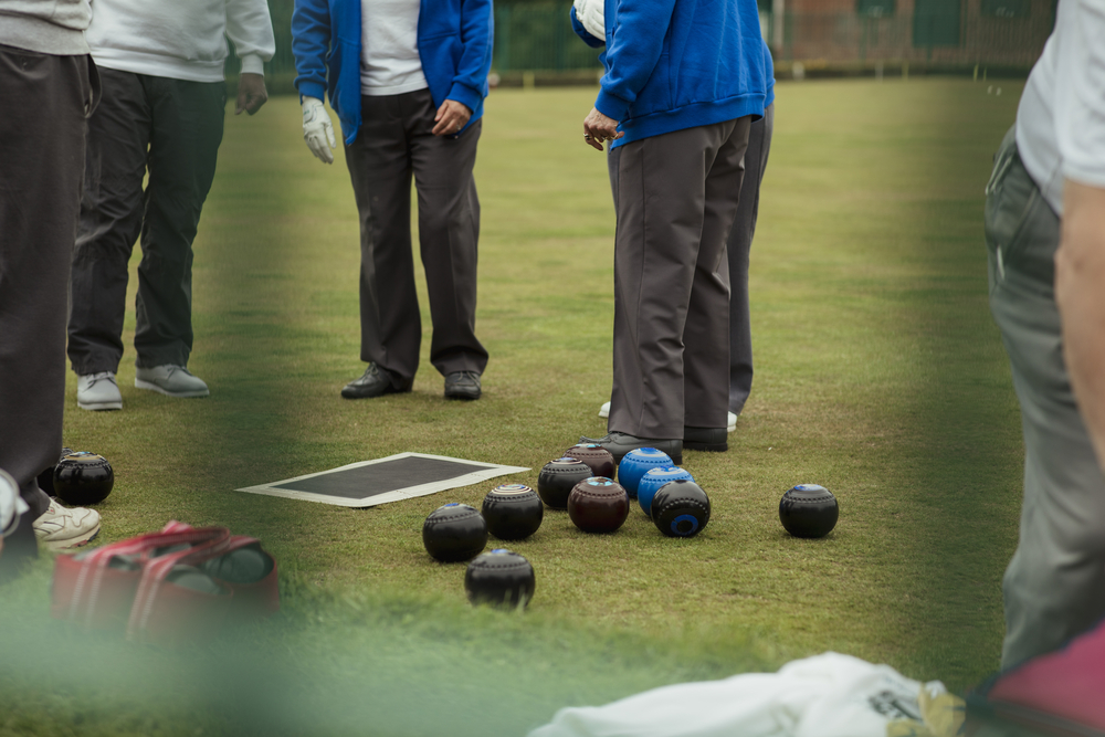 Lawn bowlers in preparation for a lawn bowling game on the bowling green