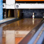 A single duckpin at the end of the lane