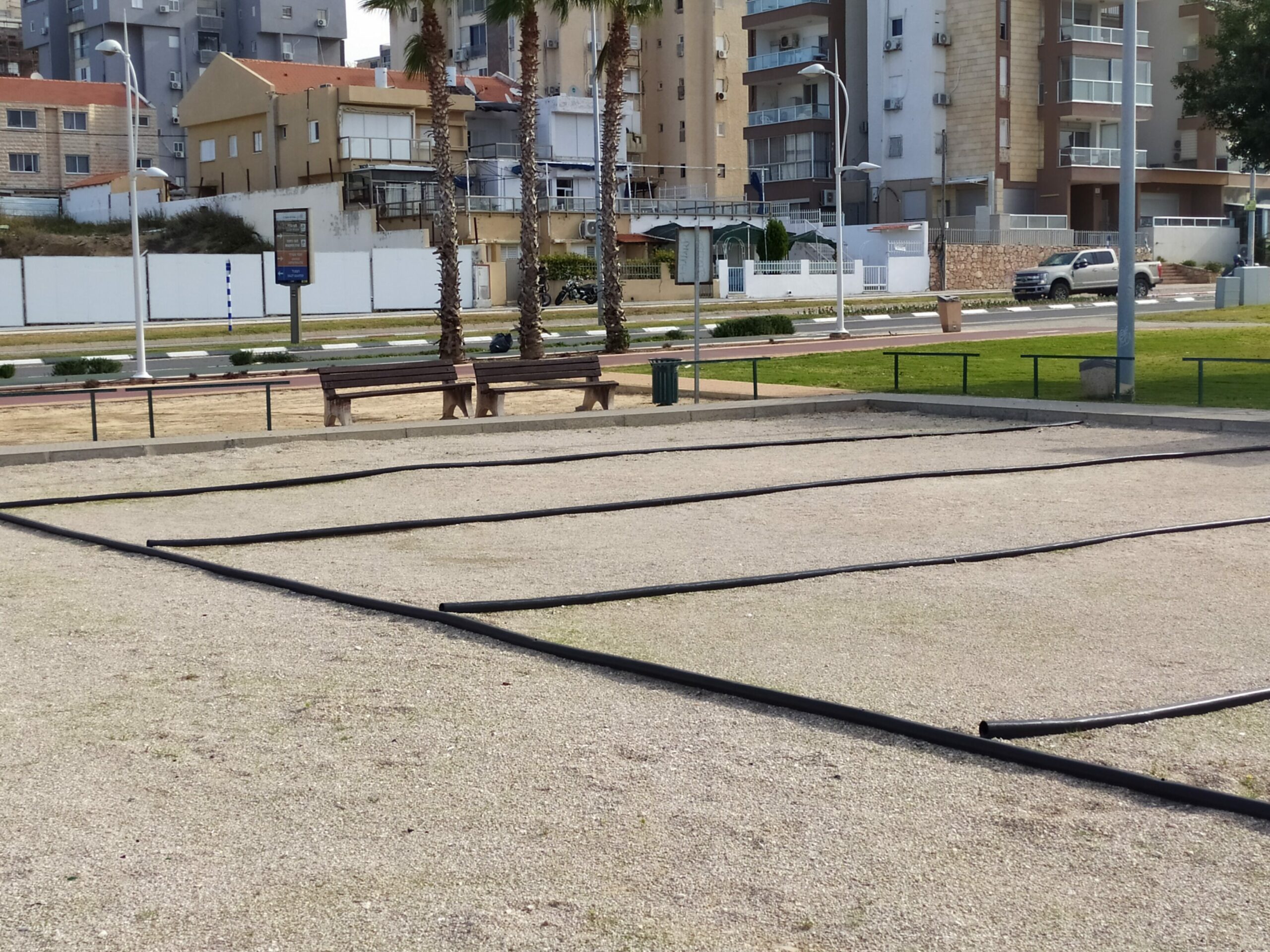 Five petanque courts for different teams with boundary lines