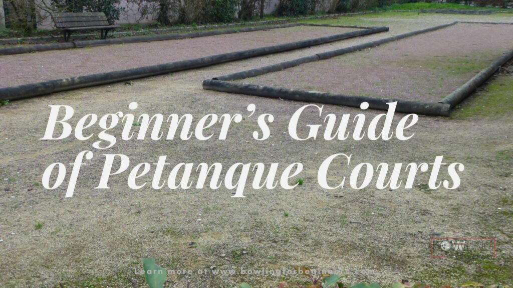 Two natural petanque courts with wood boundaries and non smooth surfaces.