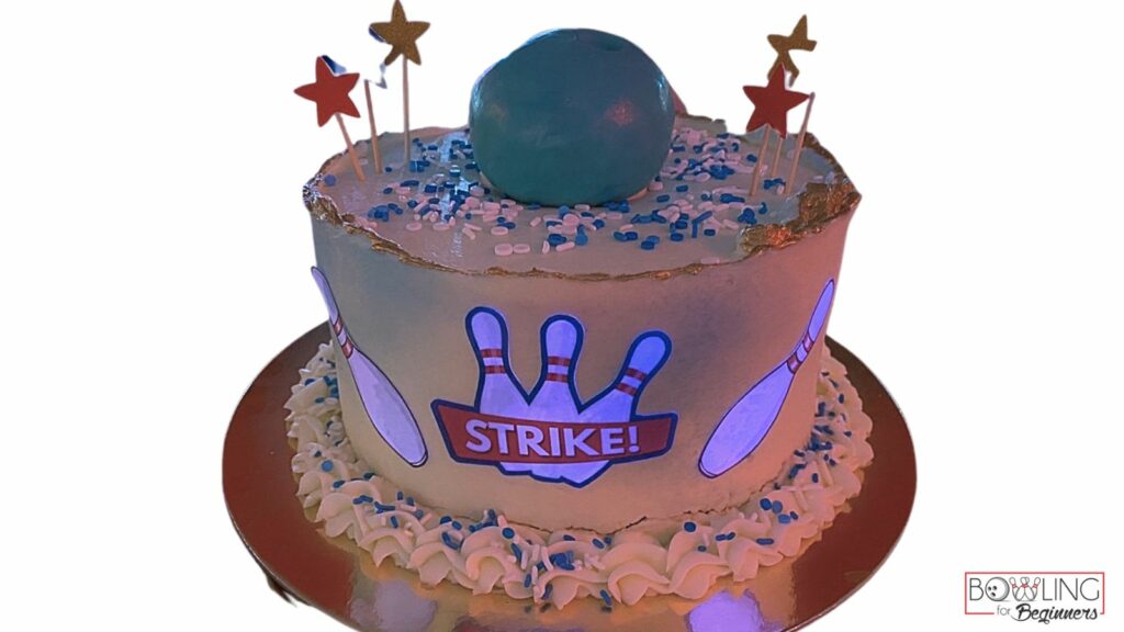 Perfect bowling cake ideas will focus on bowling in some way. This cake has the word strike and pins across the front.