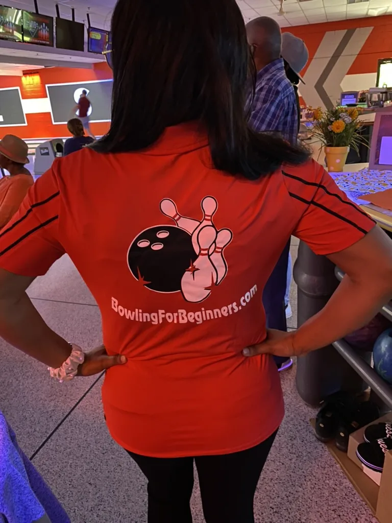 Bowling for beginner bowling red and black shirt design worn by owner/ceo kira byrd