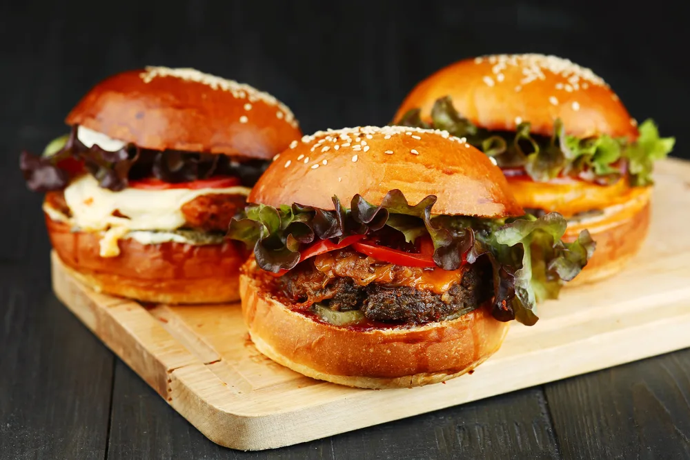 Delicious looking hamburgers on a chopping board