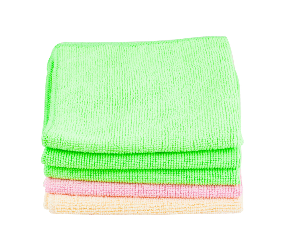 Stack of clean soft towels on white background used to keep bowling balls clean before putting in bowling bag