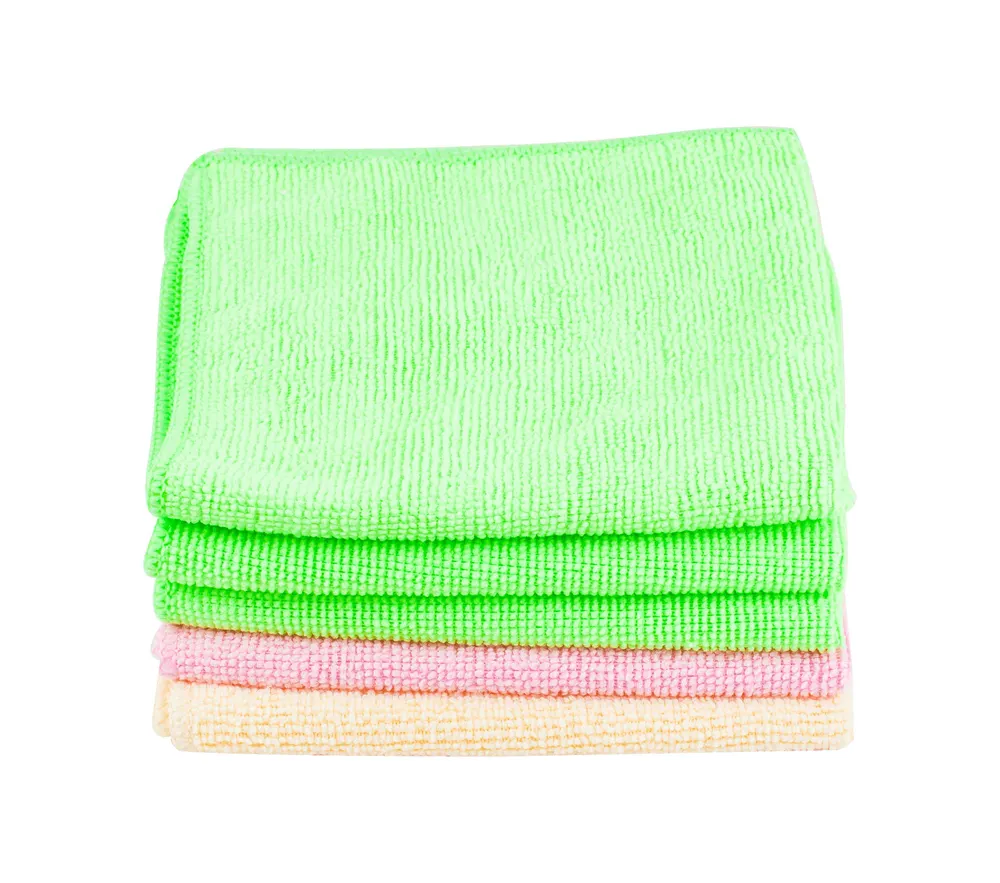 Stack of clean soft towels on white background used to keep bowling balls clean before putting in bowling bag